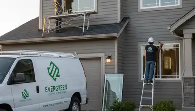 Technician repairing vinyl window frame at Buffalo NY home by Next Level Exteriors